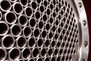 Close crop of exchanger tube mouths and curved flange edge