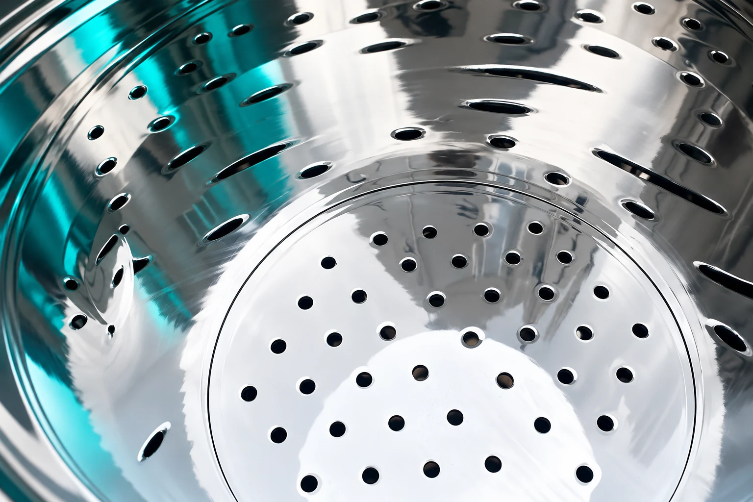 Close view of filter mounting plate openings under teal light